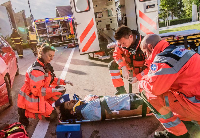 Paramedics-assisting-airbag-failure-victim