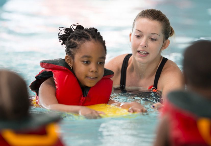 Swimming-instructor-following-safety-guidelines-to-prevent-swimming-pool-accident